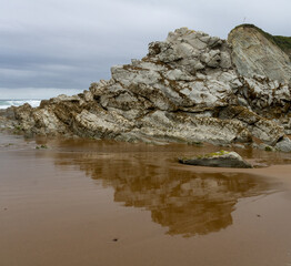 NORTH BEACH WITH LOW TIDE AND CLOUDY SPRING SKY