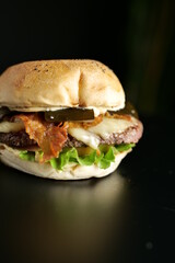tasty beef sandwich in black background