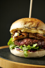 tasty beef sandwich in black background