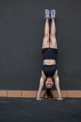 Female athlete doing handstand exercise