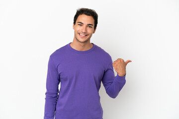 Caucasian handsome man over isolated white background pointing to the side to present a product