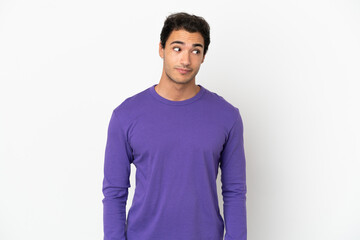 Caucasian handsome man over isolated white background making doubts gesture looking side