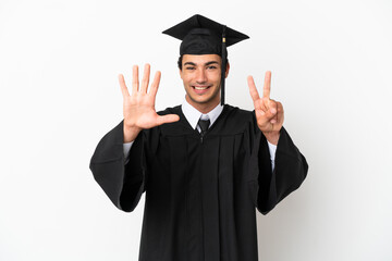 Young university graduate over isolated white background counting seven with fingers