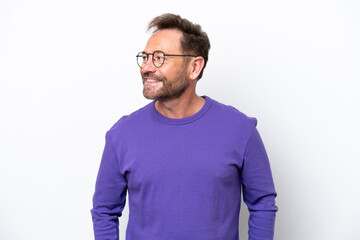 Fototapeta premium Middle age caucasian man isolated on white background looking to the side and smiling