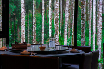 dining room, floor-to-ceiling windows, woods, view, dining table