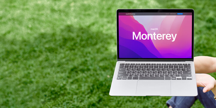 England, Newcastle, June 10, 2022: The logo of the new OS Monterey on the MacBook screen. New operating system Apple 2022. Banner with a laptop on a new operating system.