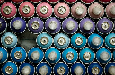 colorful spray cans in a row