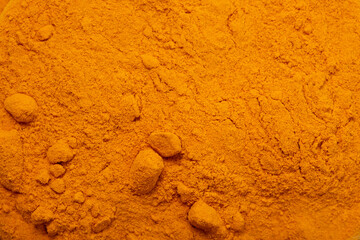 Turmeric powder close-up flat lay. Useful spices, Indian roots and herbs. Medicinal folk ingredients for food.