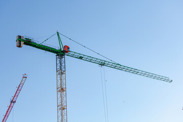 The Crane tower in construction site of a high-rise condominium. Architecture