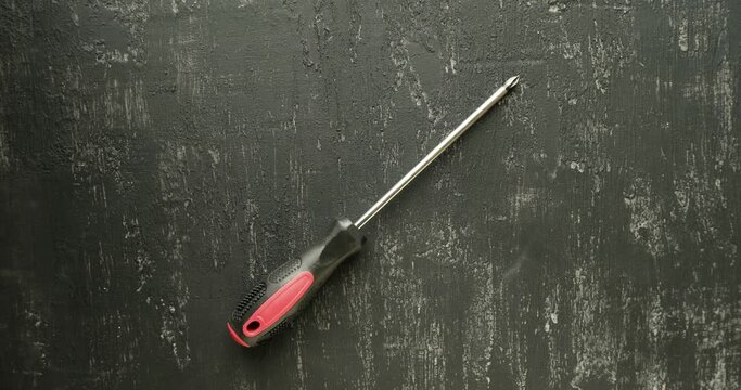 Collection of home repair tools on black background. Looped 4K stop motion animation