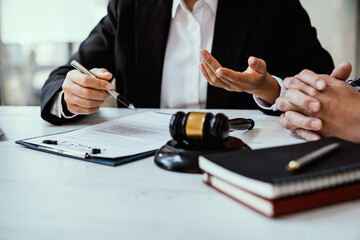 Lawyers give advice about judgment, agreements, Consultation of Businesswoman and Male lawyer or...