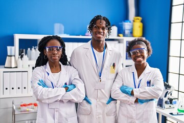 African american friends scientists standing with arms crossed gesture at laboratory