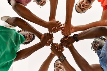 Group of young african american artist man smiling happy and holding hands together at art studio.