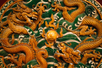 Chinese dragon statue on wall