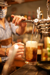 Fototapeta na wymiar cold beer in a pub spilling spill barman 