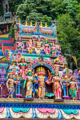 The God sculpture main entrance of Batu Caves in Gombak, Selangor, Malaysia,  which is one of the most popular Hindu shrines outside India.
The background is 272 colorful steps.