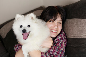 Teen girl hugging her anti depressant, her dog and girl happy and smiling, her doggy helped to...