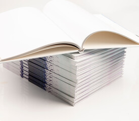 open photo book a stack of books