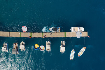 Eilat \ israel Aug 20 2020 : Top view of a floating pier and colorful boats next to it