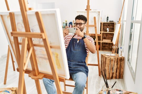 Young arab artist man make photo to draw at art studio.