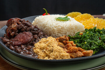FEIJOADA: typical and traditional Brazilian cuisine, paired with Caipirinha and beer.