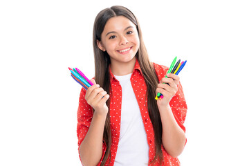 School girl with colorful pencils isolated on white background. Portrait of happy smiling teenage child schoolgirl.