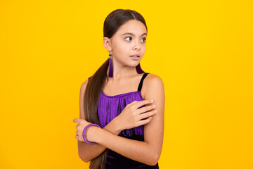 Obraz premium Emotional portrait of caucasian teenager child girl isolated on yellow background.