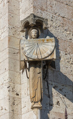 angel holding a sundial