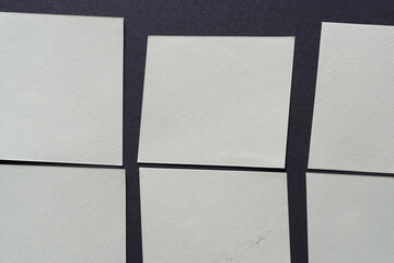paper squares on dark gray