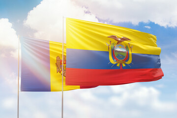 Sunny blue sky and flags of ecuador and moldova