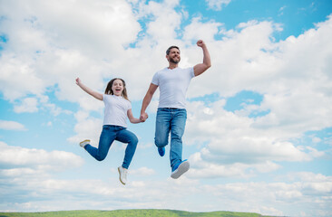Fototapeta na wymiar happy father and daughter jump in sky. family support
