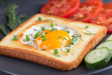 Sandwich with fried egg. Fast food. Preparation of lunch, dinner, breakfast. A natural product. Cooked omelet.