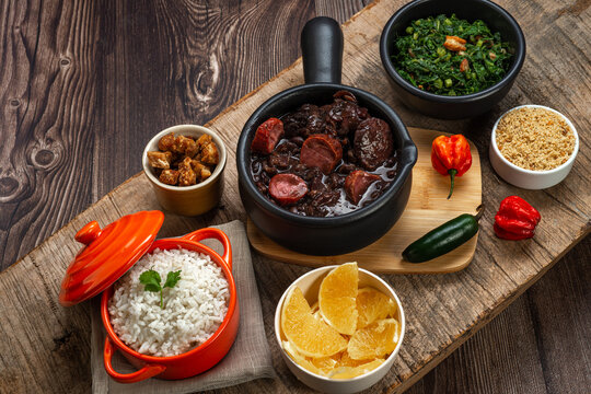 FEIJOADA: typical and traditional Brazilian cuisine, paired with Caipirinha and beer.