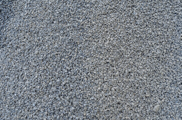 Abstract stone texture. Fine gray gravel. Small gray stones.  Building material.