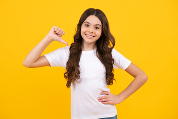 Happy teenager, positive and smiling emotions of teen girl. Teenager child girl point thumb herself. Choose me. Girl pointing at herself.