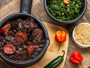 FEIJOADA: typical and traditional Brazilian cuisine, paired with Caipirinha and beer.