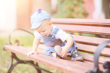 baby child on a summer walk in the park