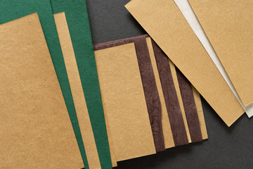 gold toned paper interleaved with green, brown, and white paper