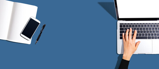 Person using a laptop computer from above