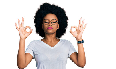 Young african american woman wearing casual white t shirt relaxed and smiling with eyes closed doing meditation gesture with fingers. yoga concept.