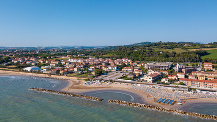 Italy, June 2022; aerial view of Fano with its sea, beaches, port, umbrellas in the marche region