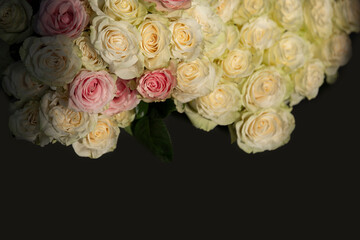 Beautiful vintage bouquet of white roses on a dark background.