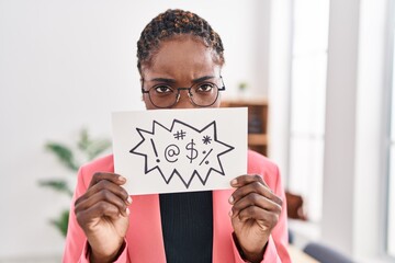 African american woman business worker holding insult banner at office - obrazy, fototapety, plakaty