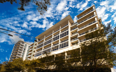 Residential high rise apartment building in inner Sydney suburb NSW Australia. Residential complex in leafy suburbia. Urban living high density suburban city 
