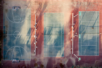 Aerial view of basketball court and tennis courts