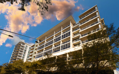 Residential high rise apartment building in inner Sydney suburb NSW Australia. Residential complex in leafy suburbia. Urban living high density suburban city 