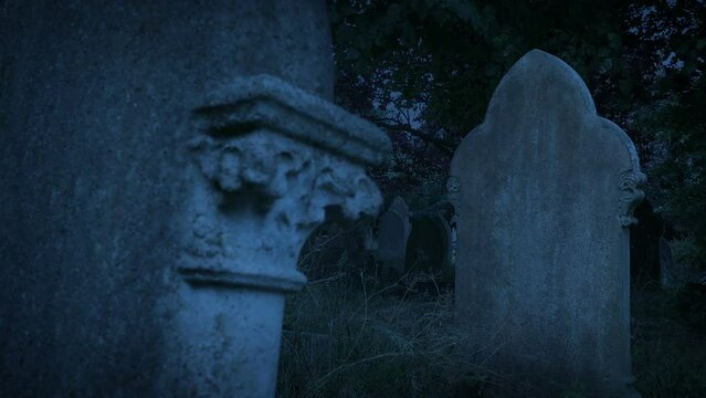 Graves In The Cemetery At Dusk