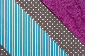 blue stripes, brown and white dots, and purple paper background