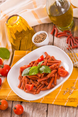 Lentil pasta with cherry tomatoes and basil.