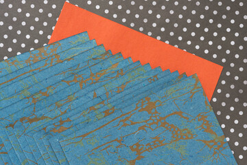 paper pile, orange paper, and paper with polka dots